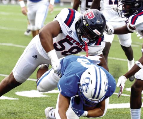 Mark Watkins (58) was a Second-Team defensive selection as a linebacker. LANCE MCCURLEY/Staff