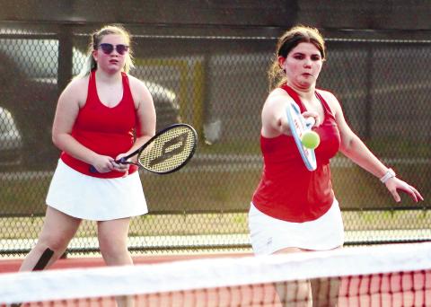 Carolyn Thomas gets a return in a doubles match victory with partner Cadence Fox. ARELLA CASH/Staff