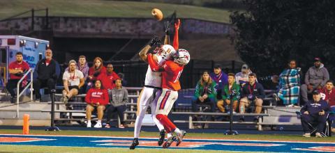 University of the Cumberlands cornerback Malik Thornton (right) reaches up to deflect a pass near the end zone. CONTRIBUTED