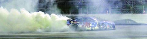 Chase Elliott celebrates Saturday night’s win at EchoPark Speedway with a burnout. BRAD HARRISON/Staff
