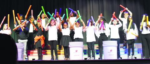 Fourth-grade students perform the melody line of “I Feel Good” by James Brown on Boomwhacker percussion tubes. LENA HENSLEY/Staff