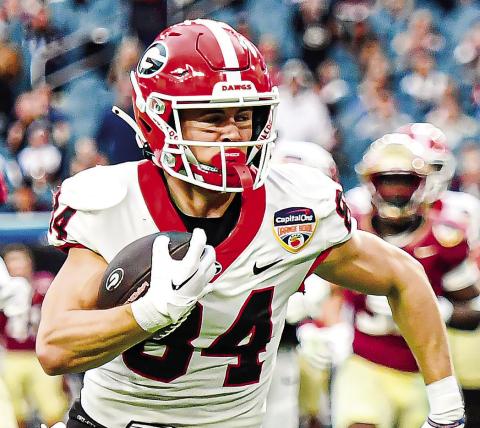Ladd McConkey improvised on a failed trick play to run 27 yards for a touchdown. CHARLES JORDAN/Staff