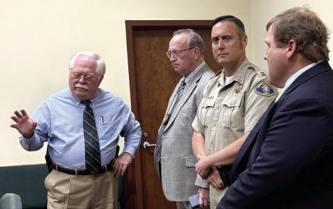 L-R: Putnam County Sheriff Howard Sills, Jones County Sheriff’s Office Chief Deputy Earl Humphries, Capt. Travis Douglas and Investigator John Simmons at a May 16 press conference. DEBBIE LURIE-SMITH/Staff