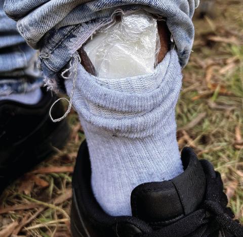 Bagged cocaine is seen in the cuff of Omar Andrews as he was being arrested for an active warrant. CONTRIBUTED/EPD