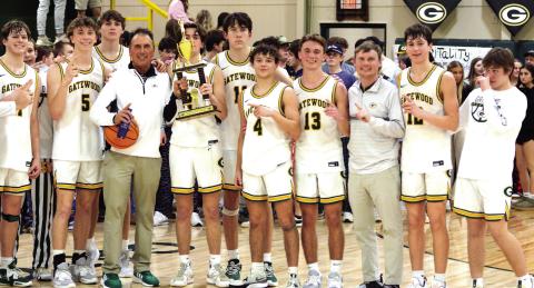 JT Gregory holds the trophy signifying the Gatewood Gators as GIAA 2-AA regular-season champs for the second-straight year. IAN TOCHER/Staff