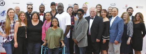 The cast of “83 Days,” the _lm which kicked o the 2019 Milledgeville-Eatonton Film Festival, pose together on the red carpet at The Plaza Arts Center in Eatonton. FILE PHOTO