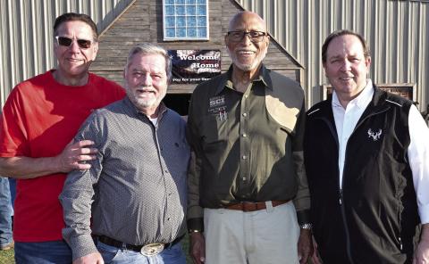 L-R: Chuck Brake of the Lake Oconee Elks Lodge, SCI Director-at-Large and Chapter Vice President James Lakeman, Georgia SCI Chapter President Lester Richardson, and SCI Chief Operating Officer Louie Cole greeted veterans as they entered the Honoring Our Heroes event earlier this month at Briarpatch Farms. CONTRIBUTED
