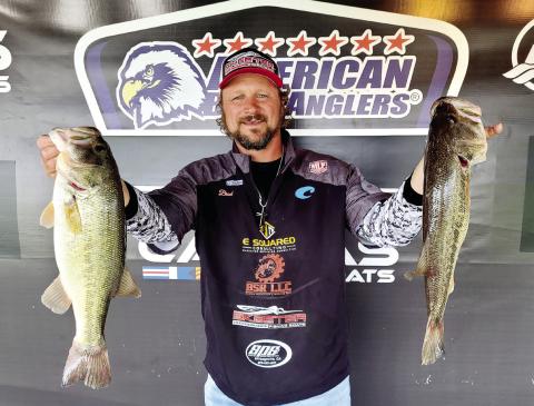 Eatonton’s Brad Stalnaker holds up two of the fish that helped him win an American Bass Anglers Pro League tournament on Lake Oconee last weekend. CONTRIBUTED