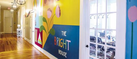 Maggie Morgan’s mural at The Bright House in Baldwin County. The mural features a colorful backdrop for a variety of simple designs hand-selected to represent hope, restoration, transformation, and growth. COURTESY OF GCSU
