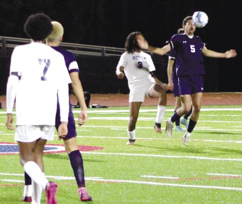 Senior Brandon Reeves (No. 5) tries to control a ball in order to score during a region game earlier this season. KIM CASH/Contributed