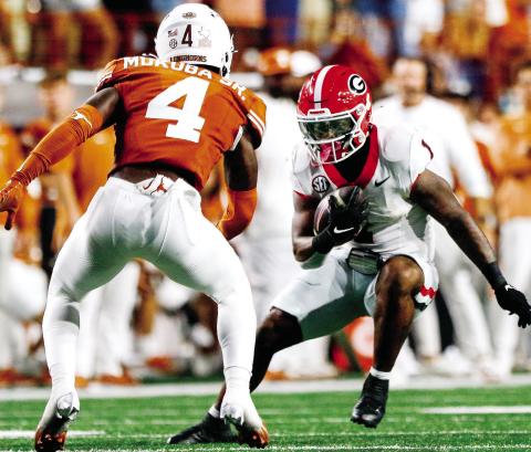 Georgia running back Trevor Etienne (1) accounted for all three Bulldog touchdowns in Austin. LANCE McCURLEY/Staff