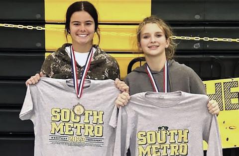 Putnam County's Lily Armistead (left) picked up her weight class win at the South Metro Invitational in Atlanta, while Lily Frisch (right) was second in her weight class.