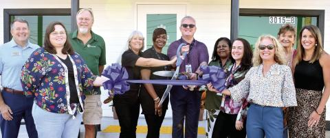 Treevana Powered by Sanctuary staff and the Milledgeville-Baldwin Chamber of Commerce cut the ribbon Sept. 9 to officially open the first medical cannabis facility in Milledgeville. BAILEY BALLARD/Staff