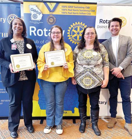 L-R: Dr. Candice Veal, Claudia Franklin,and Wanda Nix of Putnam County High School pose with Dr. Tyler Franks. CONTRIBUTED