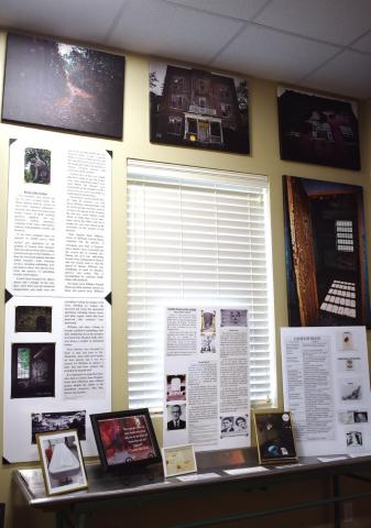 The Death at the Asylum exhibit hosts pictures, informational boards and artifacts. BAILEY MCCULLY/Staff