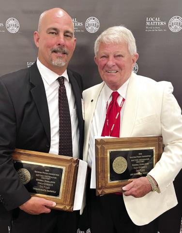 Smith Communications President and CEO A. Mark Smith Sr. (right) with General Manager Matt Smith attended the annual Georgia Press Association convention at Jekyll Island last week. CONTRIBUTED