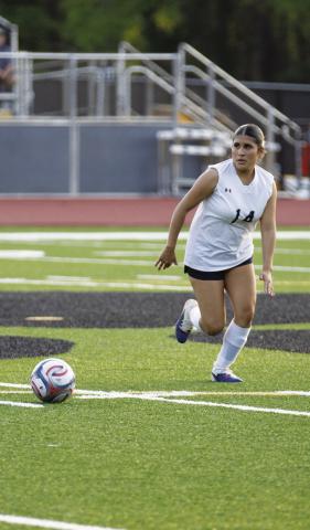 Senior striker Brenda Escutia (14) chases down a ball during a recent match for the Lady War Eagles. SKYLA MORRIS/Staff