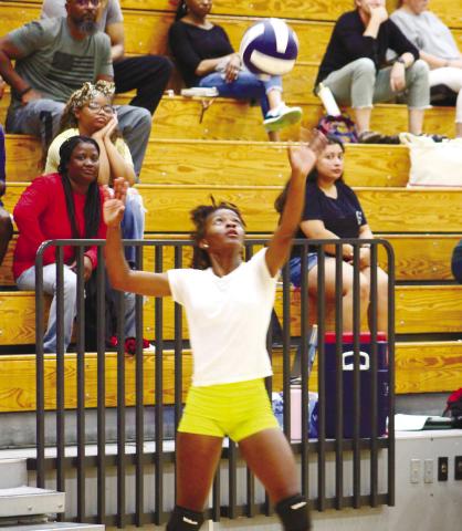 Freshman JV player Brysen Pearson prepares to serve the ball. ARELLA CASH/Staff