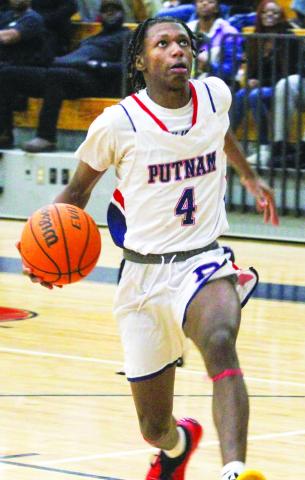 Putnam County sophomore Jaylen Nelson goes up for a layup in a win over Jones County. He had seven points against the Greyhounds. BRAD HARRISON/Staff