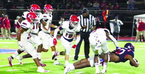 Putnam County senior running back Tamarion Peters (27) dives for the goal line past several Toombs County defenders. ARELLA CASH/Staff