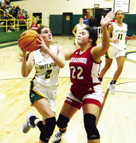 Junior Sarah Mansfield (2) goes up for a layup over Briarwood’s Aubrey Branan (22) in a 57-49 loss to the Lady Bucs on Dec. 20, 2023. KIM CASH/Staff