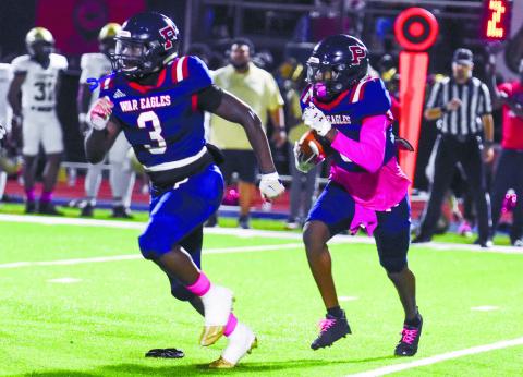 Putnam County running back Rashod Daniel (3) blocks for teammate Kaleb Crawford (9) as he runs in open field. LANCE McCURLEY/Staff