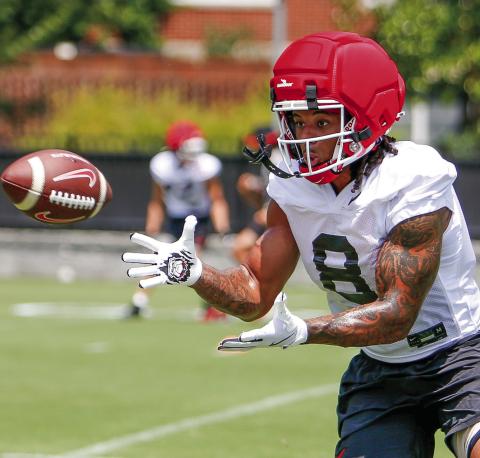 Georgia veteran defensive back Joenel Aguero prepares to catch a pass while participating in position drills during a practice on Thursday, July 31. LANCE McCURLEY/Staff