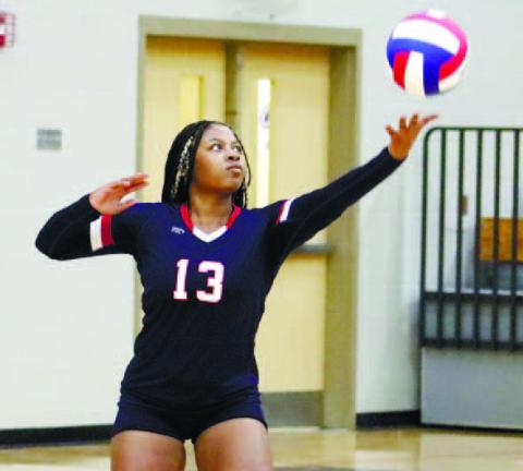 Tytianna Little (No. 13) gets set to serve. ARELLA CASH/Staff