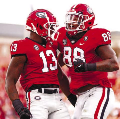 Georgia defensive linemen Mykel Williams (13) and Jalen Carter (88) celebrate during the win against Tennessee. (TONY WALSH/UGA Athletics)