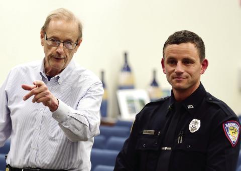 Eatonton Police Chief Howell Cardwell (left) introduced Officer Matthew Shiver to the council, emphasizing how well Shiver did in his 16-week, staterun police academy training. IAN TOCHER/Staff