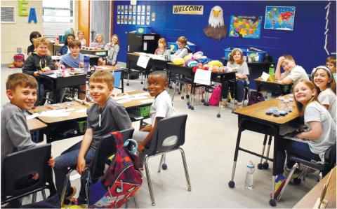 Third-grade business owners are ready for the customers in Dr. Rita Thomas’ classroom.