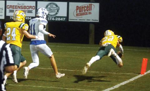 This diving play early in the second half by Hunter Johnson (22) marked the start of an impressive comeback for the Gators, who punched their ticket to Damascus for a semi-final playoff showdown this Friday against Southland Academy. IAN TOCHER/Staff