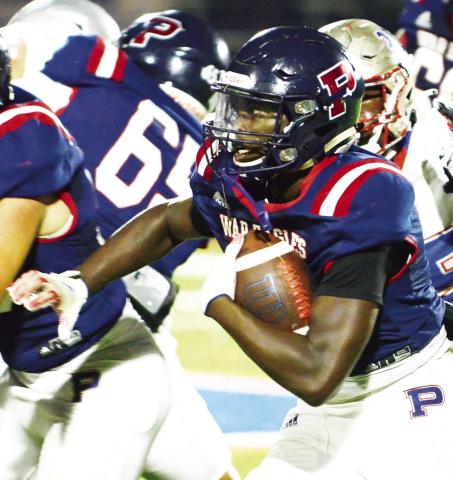 Rashod Daniel carries the ball for Putnam County earlier this school season. IAN TOCHER/Staff