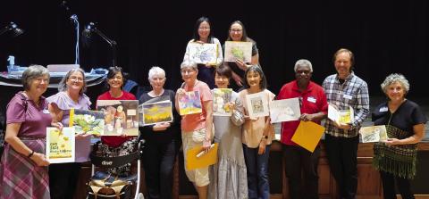 Artists with the artwork after the exchange. (CONTRIBUTED)