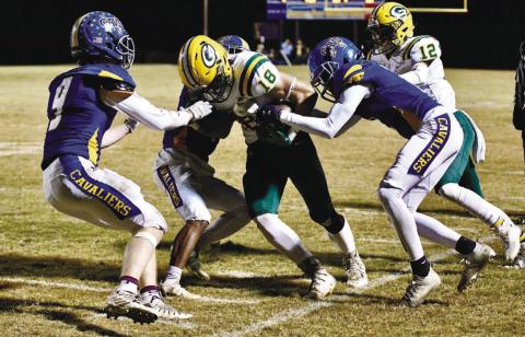 Dylan Sinclair (18) tries to break free from a couple of defenders. CONTRIBUTED/Dawn Sinclair