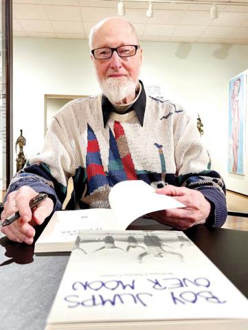 Willaim Charles “Chuck” Connor signs copies of his trilogy of books last Saturday at STMA in Buckhead. IAN TOCHER/Staff