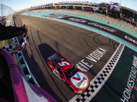 Kyle Larson, driver of the #5 Valvoline Chevrolet, takes the checkered flag to win the Cup Series Dixie Vodka 400 at Homestead-Miami Speedway Sunday. (Jared East/Getty Images)