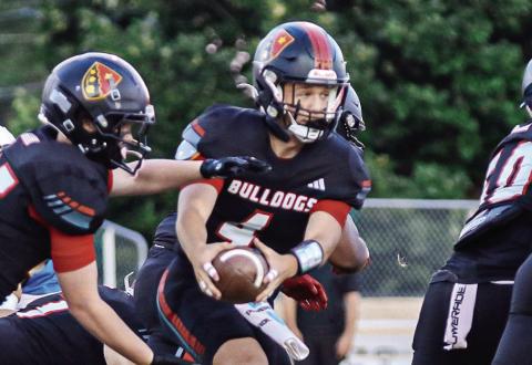 GMC Prep quarterback Cason Dennis (4) hands off the ball to a teammate last season. TREY NORRIS/Staff