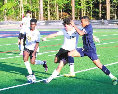 Marko Owensby battles with two Vidalia players for control of the play. KIM CASH/Staff