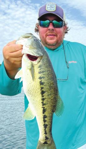 James with a Lanier spotted bass caught on a Sebile.