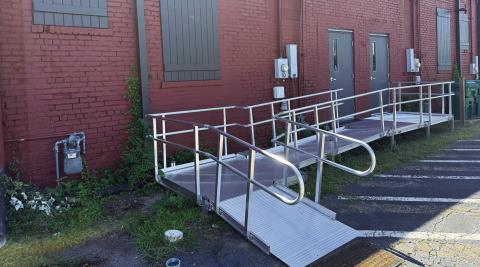 The most prominent features of the refurbished back entrance to the Georgia Writers Museum are the new wheelchair ramp, new doors, and decorative shutters covering long-ago bricked-in window openings. IAN TOCHER/Staff
