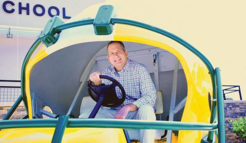 New Gatewood Head of School Jon Fadely takes a turn behind the wheel of the Gators’ football-themed golf cart, a fitting ride for the avid golfer who lives with his wife at Reynolds in Greene County. IAN TOCHER/Staff