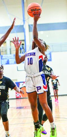 Lady War Eagles’ freshman Journey Waller (10) goes up for a contest layup against Greene County. 