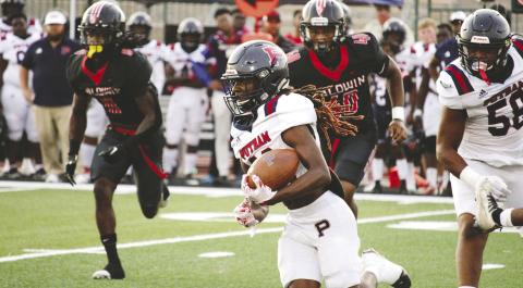 Putnam County running back Bryson Brown turns up field for a first down. TREY NORRIS/Staff