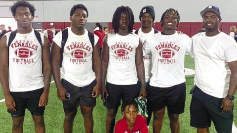L-R: Kaleb Crawford, Zacoree Wallace, Tyson Waller, Rashod Daniel and Bryson Brown learned a lot thanks to Putnam County defensive backs coach Kedric Manning (far right) during the football camp at the University of Oklahoma last weekend. LANCE MCCURLEY /Staff