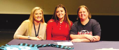 It was a happy day at Putnam Cough High School as (l-r) Jessica Castillo (assistant soccer coach), Tesa Shelton, Brandi Barling (head coach) celebrate Tesa’s scholarship to GMC. LANCE MCCURLEY /Staff