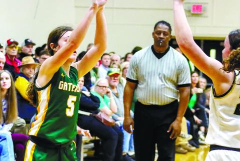 Freshman Natalie Sills (5) shoots for 3 for the Gators. LANCE McCURLEY/Staff