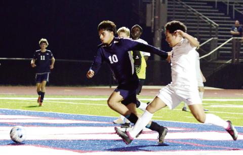 Putnam County leading-scorer Emmanuel Meraz (10) races to score a goal past a defender last Thursday in a win over Westside-Augusta. IAN TOCHER/Staff