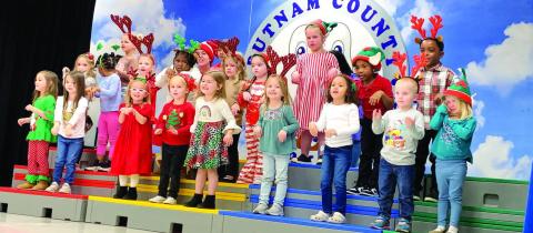 The Pre-K Carolers close the showcase by singing The Reindeer Pokey. BAILEY MCCULLY/Staff