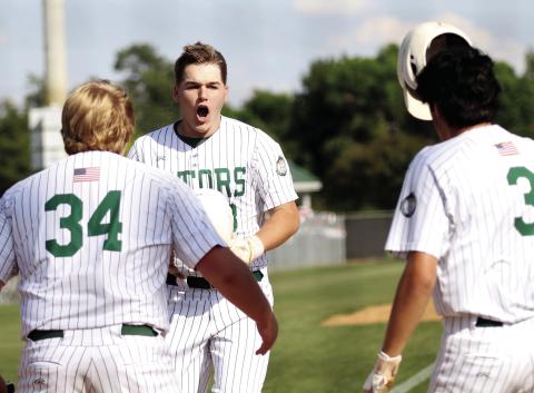 Gatewood’s Lawson Moore takes off his helmet and celebrates with teammates after hitting of his two home runs against Trinity Christian. TREY NORRIS/Staff